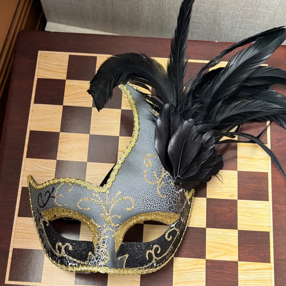 Elegant Black and Gold Masquerade Mask with Feathers